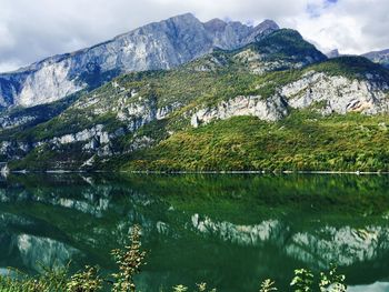 Scenic view of lake and mountains against sky