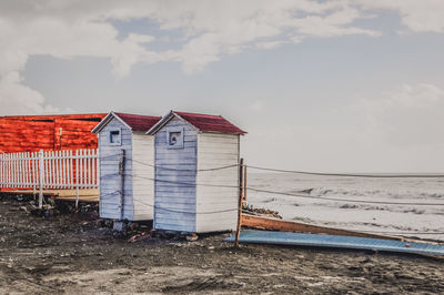 House on beach against sky