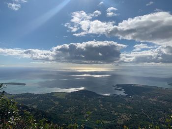 Scenic view of landscape against sky on sunny day