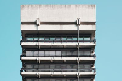 Low angle view of building against clear blue sky