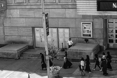 Woman standing in front of building