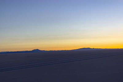 Scenic view of silhouette mountain against sky during sunset