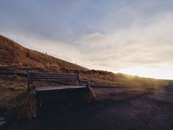 Scenic view of landscape against cloudy sky