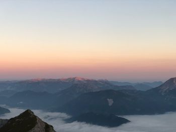 Scenic view of mountains against sky during sunset