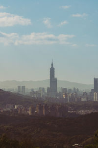 Buildings in city against sky