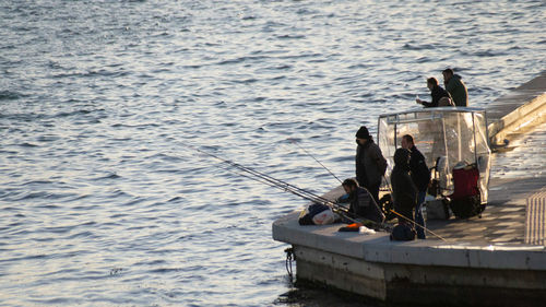 High angle view of people on boat at sea