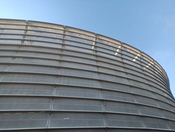 Low angle view of modern building against clear blue sky