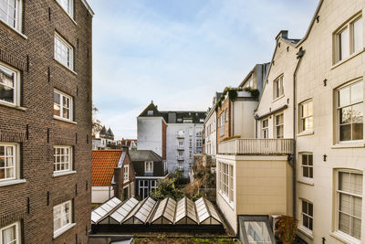 Buildings in city against sky