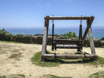 Built structure on beach against clear sky