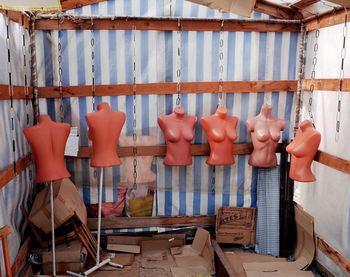 Clothes hanging on display at market stall