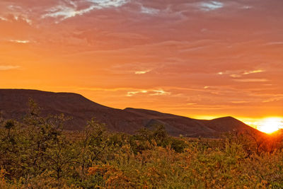 Scenic view of mountains against sky during sunset