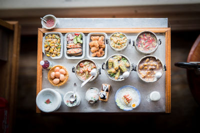 High angle view of various food in tray on table