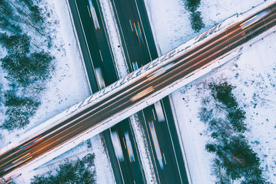 Aerial view of bridge over snow covered field