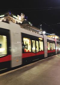 Train at railroad station at night