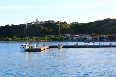 Boats in sea against sky