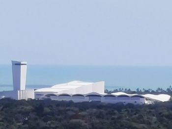 Built structure on beach against clear sky