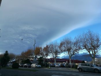 Cars on road against sky