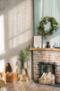 Modern concept of christmas interior design. cozy living room decorated with a wreath, fireplace