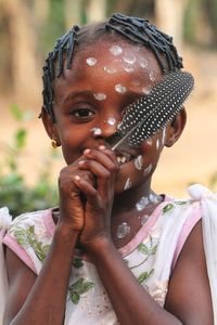 Portrait of young woman drinking water