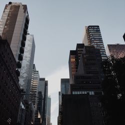 Low angle view of buildings against sky in city