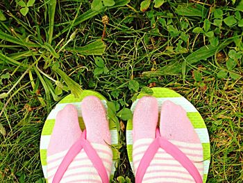 Full length of woman walking on grassy field