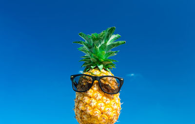 Close-up of banana against blue background