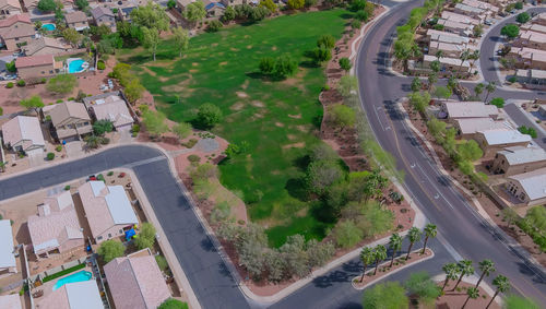 High angle view of road by buildings in city