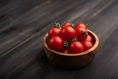 High angle view of tomatoes in basket on table