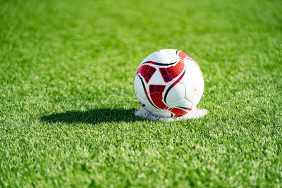 Close-up of ball on soccer field