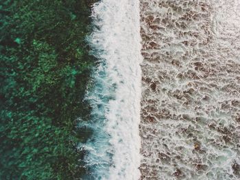 Scenic view of sea waves splashing on shore