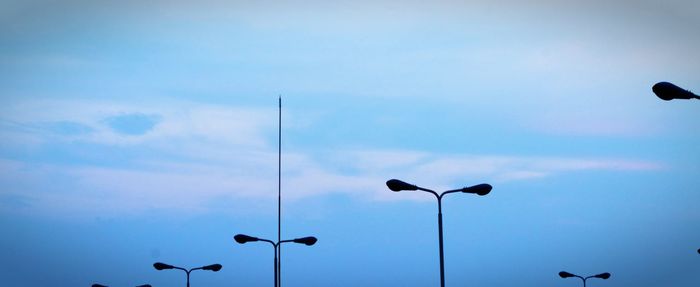 Low angle view of street light against sky