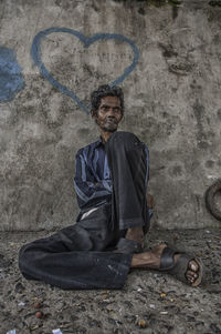 Man sitting on wall