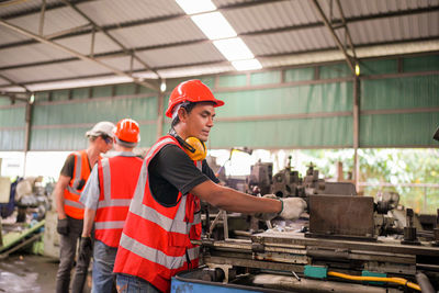 Rear view of man working at construction site