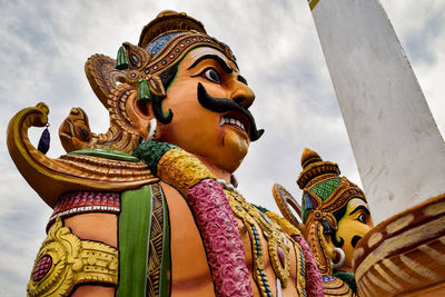 Low angle view of statue against sky