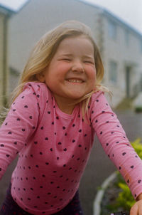 Little blonde girl on her bike. 