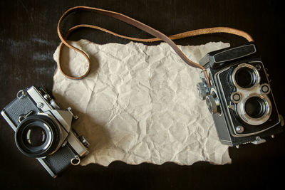 Directly above shot of old cameras on table