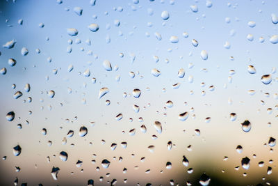 Full frame shot of wet glass window