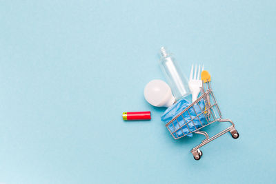 High angle view of toys on table against blue background