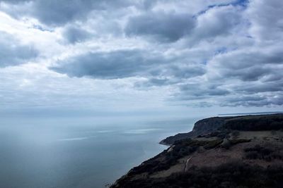 Scenic view of sea against cloudy sky