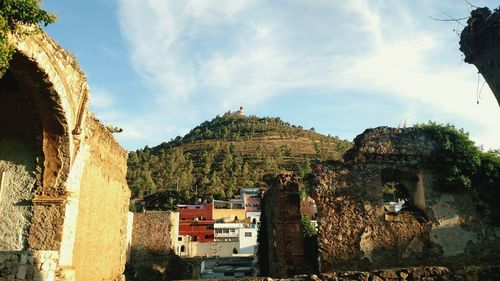 Low angle view of old ruins against sky