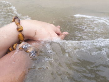 Close-up of hand in water