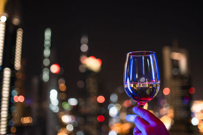 Close-up of hand holding wine glass