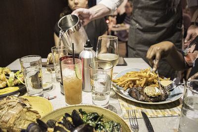 Group of people in glass on table