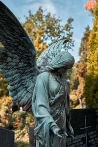 Low angle view of statue against sky