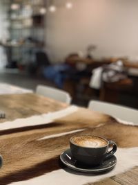 Coffee mug on a table at a coffee shop