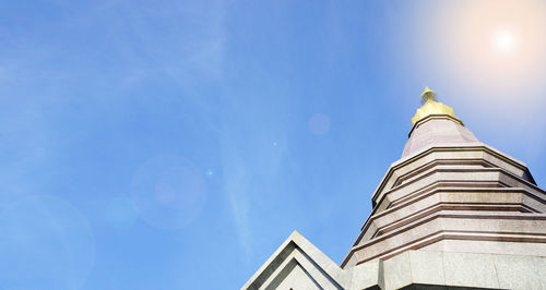 Thai temple on the top of mountain with blue sky and sunshine in chiangmai,thailand