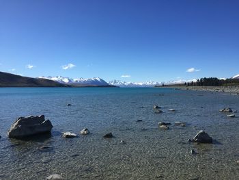 Scenic view of sea against blue sky