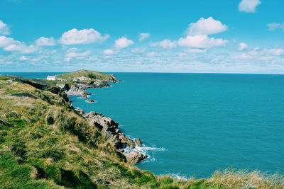 Scenic view of sea against cloudy sky