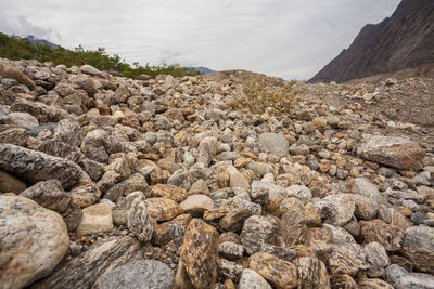 View of rocks on land against sky