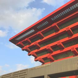 Low angle view of red building against sky